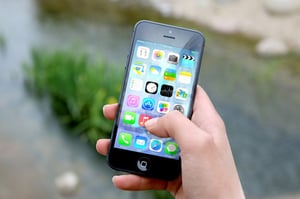person using an iPhone