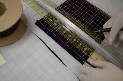 hand trimming an amorphous silicon thin-film solar panel