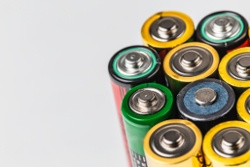 Different colored batteries lined up in a row