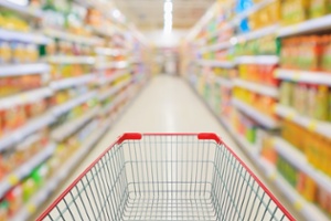 supermarket aisle with a shopping cart and blurred aisles