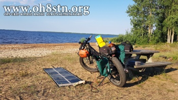 160W Crystalline Foldable Solar Panel charging an eBike on the beach