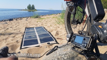 Solar panel, eBike, and ham radio on the beach