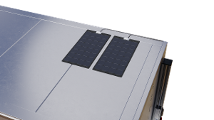 Close-up of a trailer surface with two small solar panels mounted on top