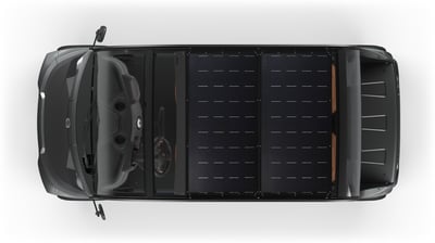 Top-down view of a black GEM low-speed electric vehicle equipped with PowerFilm solar panels covering the roof.