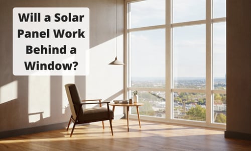 Sunlit modern room with large floor-to-ceiling window, armchair, and small table. Overlay text reads: “Will a Solar Panel Work Behind a Window?” Cityscape visible outside.