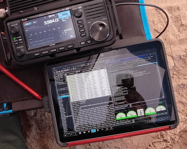 Amateur radio transceiver operating from battery power as part of a solar-supported off-grid Field Day station.
